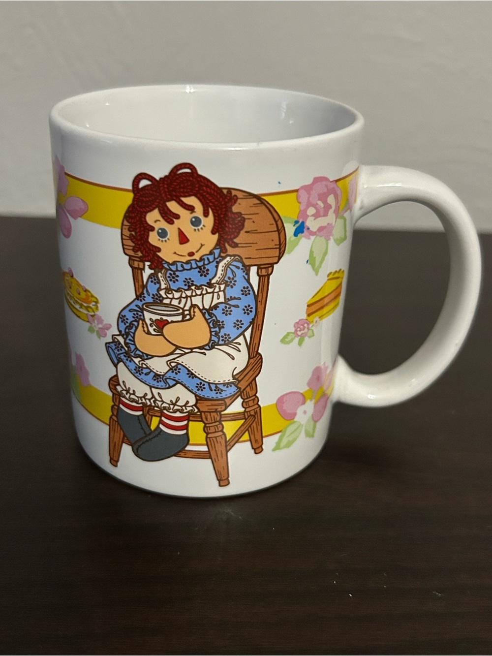 VTG Raggedy Ann & Andy 12oz. ceramic mug with a colorful "Tea Time" illustration